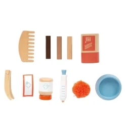 Katze mit Tasche und Pflege-Set